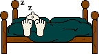 Смайлик спит в кровати