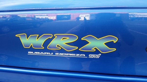 Subaru tecnica International эмблема