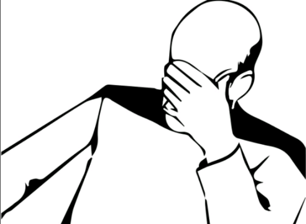 Прикрывает лицо рукой