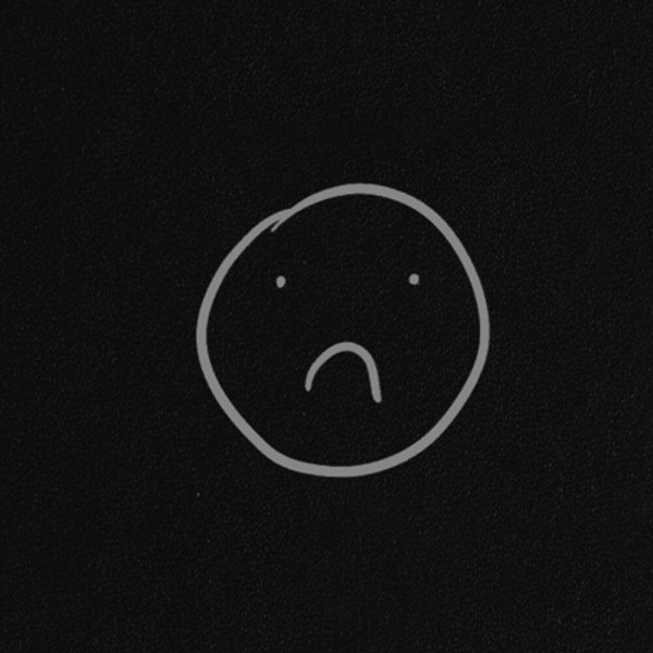 Грусный смайлик на чёрном фоне