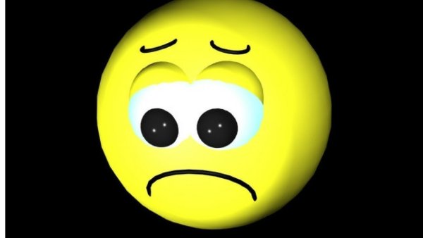 Грустный смайлик на черном фоне
