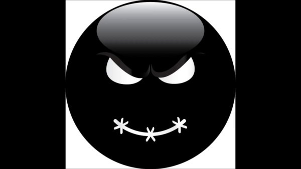 Злобный смайлик на чёрном фоне