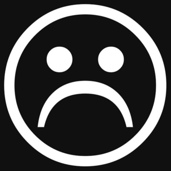 Грустный смайлик на черном фоне