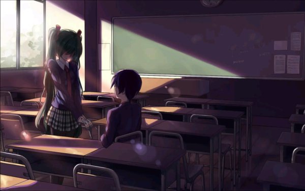 Девушка сидит за партой