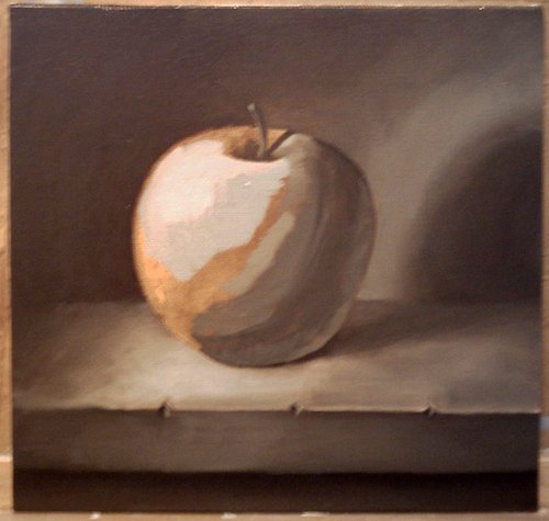 Красное яблоко маслом