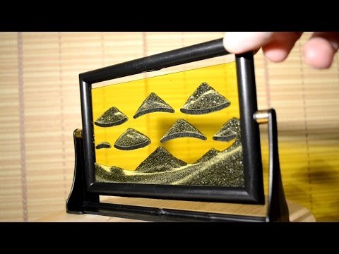 Картина из песка в рамке