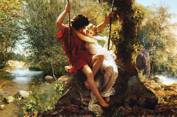 Девочка катается на качелях