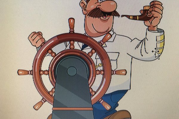 Капитан корабля у штурвала