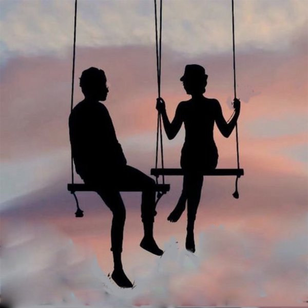 Мужчина и женщина на качелях