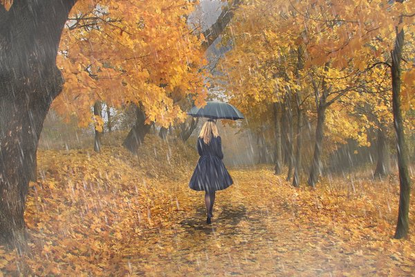 Женщина с зонтом под дождем