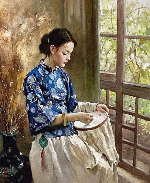 Девушка вышивает