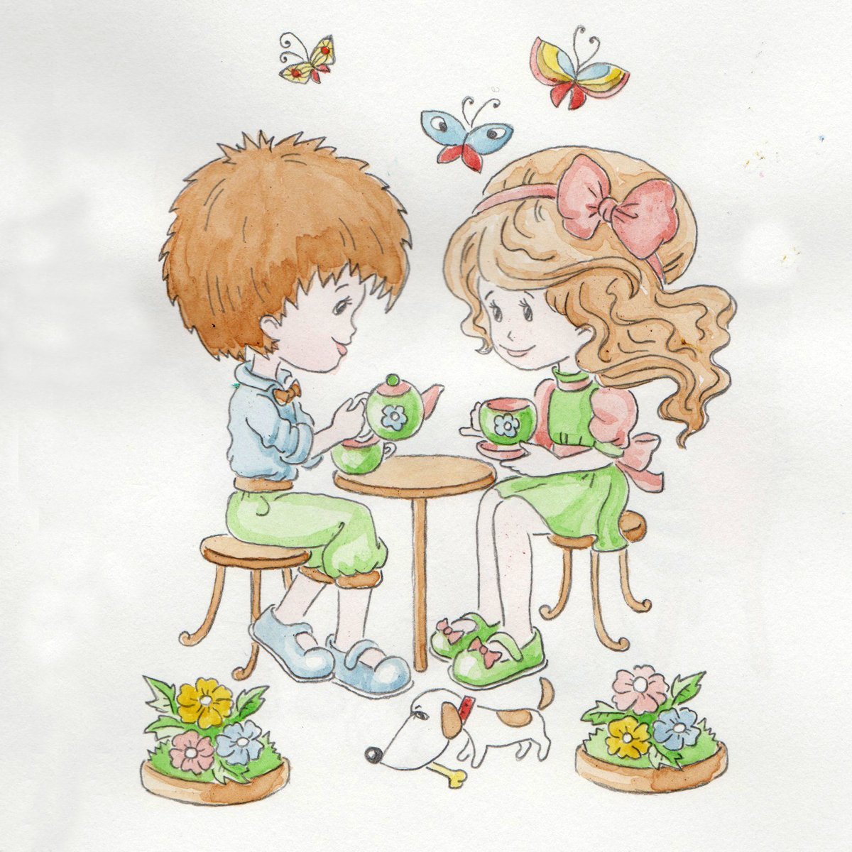 Мальчик и девочка пьют чай