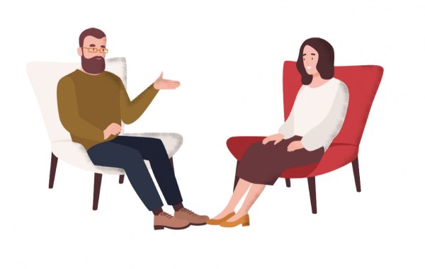 Психолог сидит в кресле