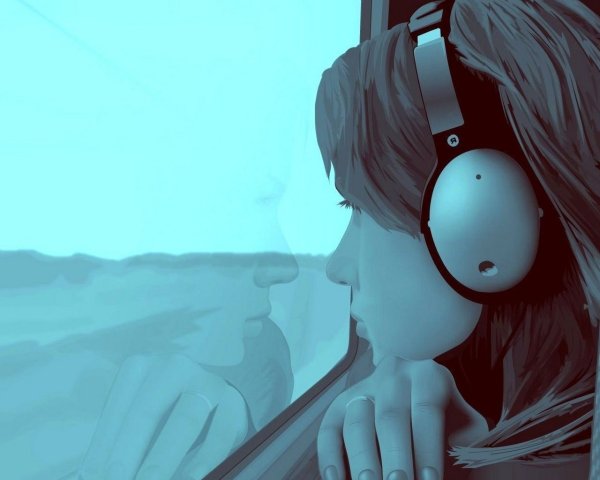 Девушка в наушниках с закрытыми глазами