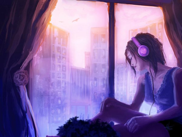 Девушка в наушниках у окна