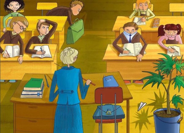 Учитель с ребенком за партой