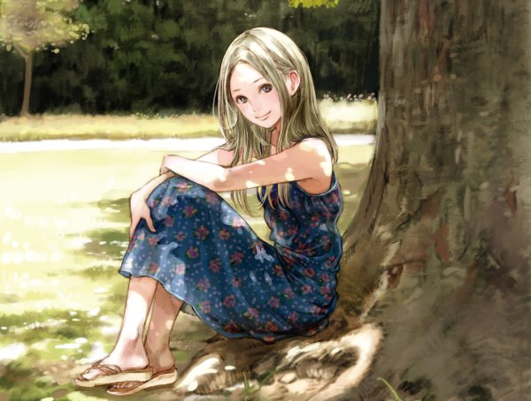 Девочка сидит под деревом