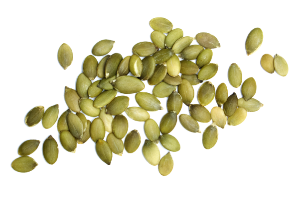 Тыквенные семечки на белом фоне