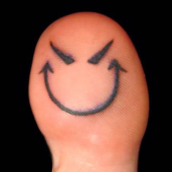 Тату смайлик