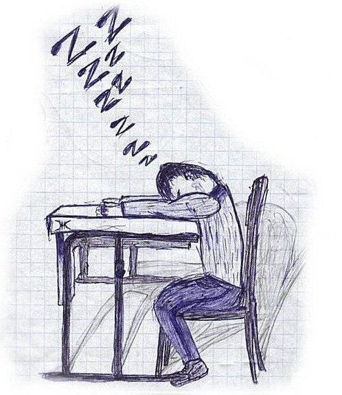 Человек сидит за партой
