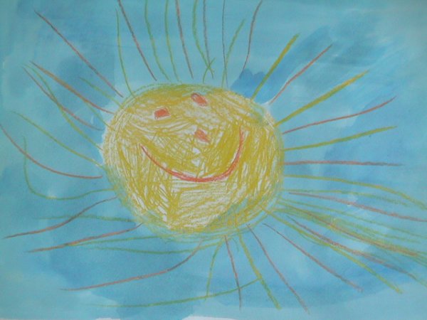 Рисование солнышка восковыми мелками