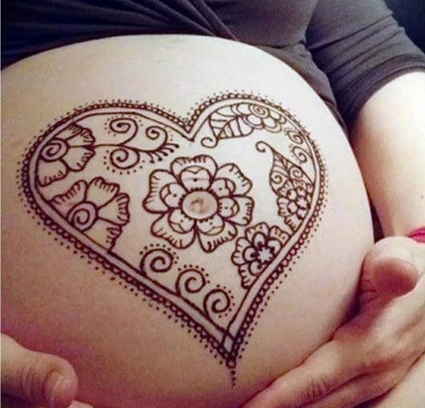 Рисунок хной на беременном животе