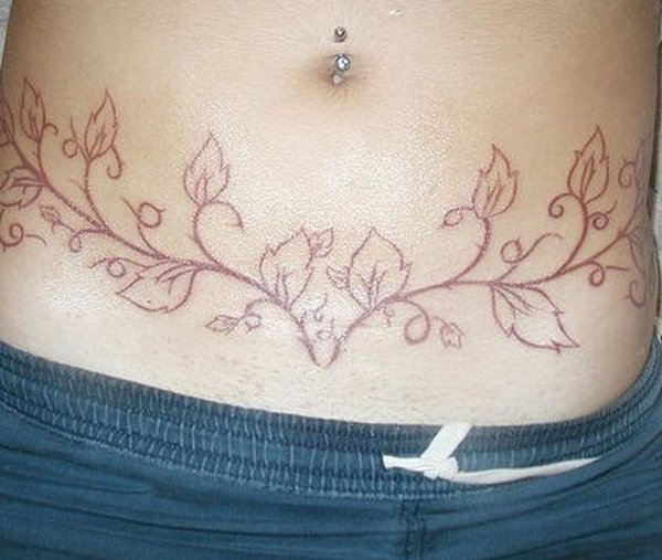 Белое тату на животе