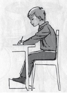 Мальчик сидит за столом