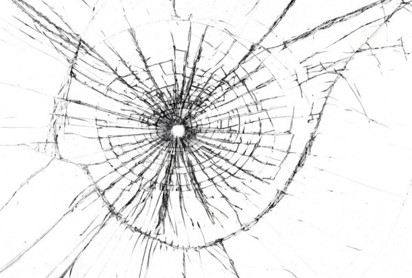 Отверстие от пули в стекле