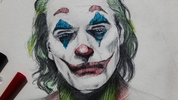 Маска на лице красками Джокер