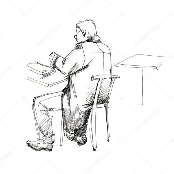 Человек сидит за столом