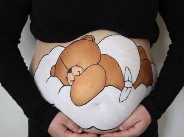 Рисование на животе беременных