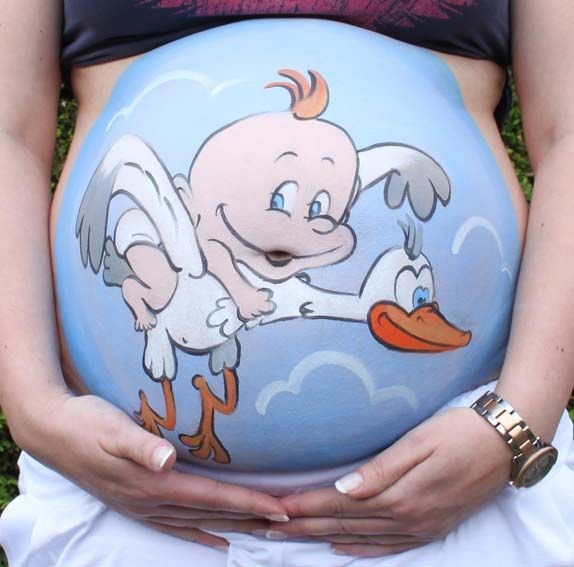 Рисование на животе беременных