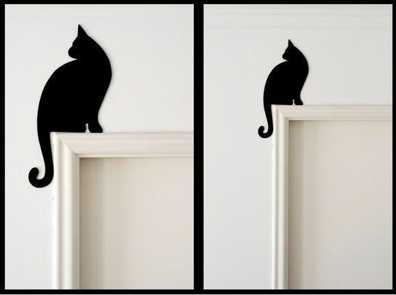Силуэт кота на стене