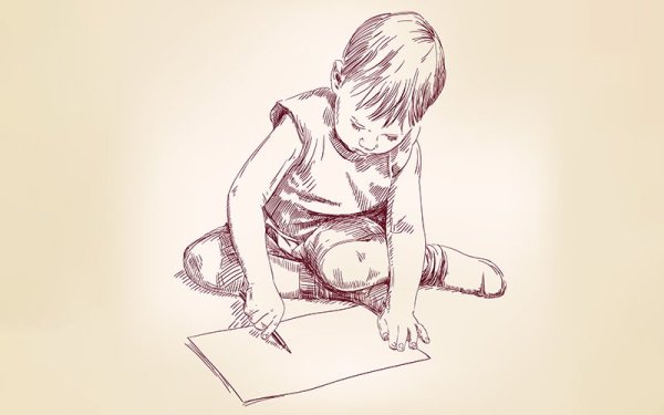 Мальчик рисует на полу