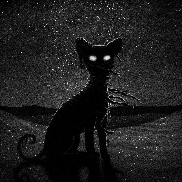 Черный кот со светящимися глазами