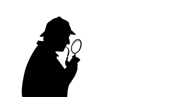 Шерлок Холмс с лупой